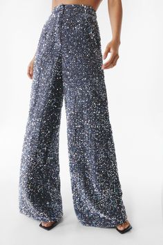 Bling in the boardroom. Feel glamorous in our sequin pants, made in high quality sequin fabric, with an extreme relaxed fit. Wear with the matching separates for a stellar occasion look, perfect for bachelorette nights, engagement parties, and all of your upcoming events, or pair with jeans to dress it down. Premium Two Piece Sequin Wide Leg Pants High Quality Sequin Fabric Head Turning Extreme Wide Leg Fit Comfortable High Waistline Button Front Fastening Matching Shorts and Blazer Sold Separately Model wears a size M (US size 6/UK size 10). Sequin Wide Leg Pants, Matching Separates, Going Out Trousers, Sequin Pants, Engagement Parties, Oasis Fashion, Sequin Fabric, Upcoming Events, Fashion Face