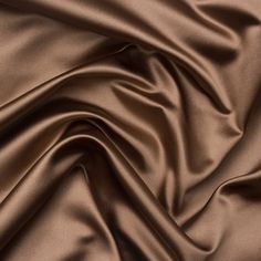 a close up view of a brown satin fabric