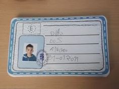 a child's id card is shown on a table