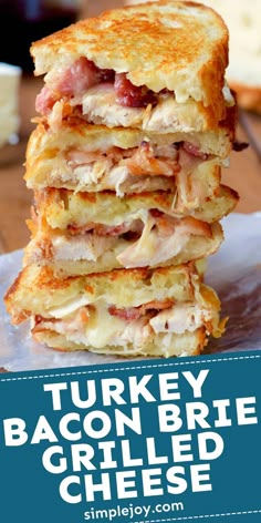 turkey bacon brie grilled cheese sandwich stacked on top of each other