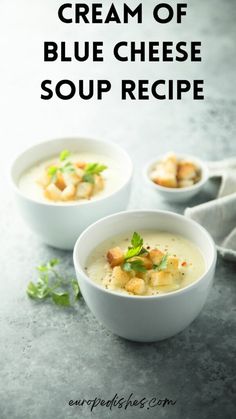 two white bowls filled with cream of blue cheese soup