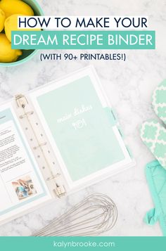 a recipe binder with lemons and other kitchen utensils next to it