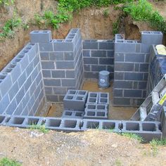 a cinder block structure with bricks in the middle