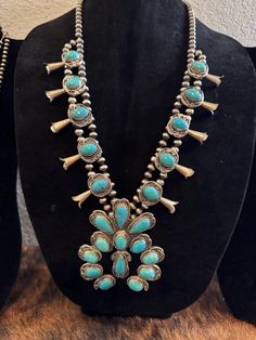 Large sleeping beauty turquoise squash blossom necklace by Gilbert Nez. Hallmarked and stamped. Shown in photos Turquoise Squash Blossom, Squash Blossom Necklace, Squash Blossom, Sleeping Beauty Turquoise, Sleeping Beauty, Jewelry Necklace Pendant, Pendant Necklaces, Beauty Book, Blossom