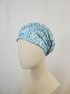 Slouchy chemo hat in blue paisley print. Shades of blue with a little of pink and yellow. Please note this hat style has a different cut. Two layers of thin T shirt type jersey knit. Material is rayon lycra knit. The weight of this chemo hat is light weight. Casual style, can be styled in several ways to suit your needs. The print is very large and pattern placement will vary on each hat.  One size fits most. Gentle wash and cool dryer. Made in USA. Slouchy Hats, Chemo Hat, Hat Style, Slouchy Hat, Blue Paisley, Pink And Yellow, Paisley Print, Hat Fashion, Types Of Shirts