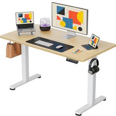 a computer desk with two monitors and a laptop sitting on it's standup