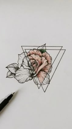 a pencil drawing of a rose on top of a piece of paper