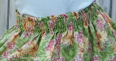 a close up of a skirt with flowers on it