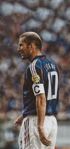 a man standing on top of a soccer field