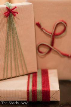 an image of a gift wrapped in white paper and tied up with red twine