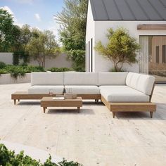 a couch and coffee table on a patio