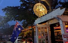 an australian flag flying in front of a store