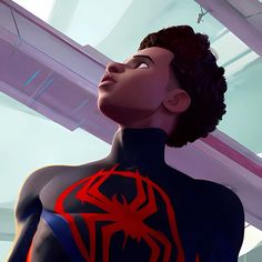 a woman with black hair and red spider - man logo on her chest looking up