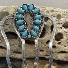 Add a touch of Southwest to your hairstyle with this stunning Native American hair pin. The horseshoe-shaped clip is made of silver and features a beautiful turquoise stone. The intricate design is signed and handmade, making it a unique and special accessory. This Western-themed hair pin is perfect for any occasion and will complement any outfit. The turquoise stone adds a pop of color and the silver metal gives it a classic touch. Don&apos;t miss out on this one-of-a-kind piece! Native American Hair, Pearl Bride, Western Turquoise, Turquoise Hair, Rhinestone Hair Comb, Bride Headband, Ear Warmer Headband, Your Hairstyle, Boutique Accessories