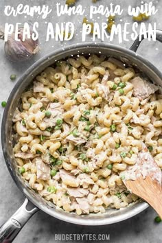 creamy tuna pasta with peas and parmesan in a skillet