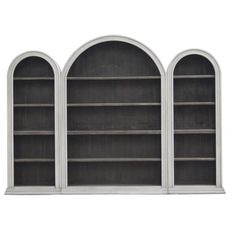 three white bookcases with arched windows on each side and two shelves below them