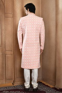 Peach sherwani with all over resham jaal embroidery. Paired with a off white churidar. - Aza Fashions Fitted Pink Sherwani With Chikankari Embroidery, Fitted Pink Sherwani With Cutdana, Pink Fitted Sherwani With Chikankari Embroidery, Pink Fitted Sherwani With Cutdana, Semi-stitched Long Sherwani With Chikankari Embroidery, Designer Pink Sherwani With Pallu Detail, Designer Pink Sherwani With Cutdana, Designer Pink Sherwani With Pallu, Pink Sherwani With Cutdana For Designer Wear