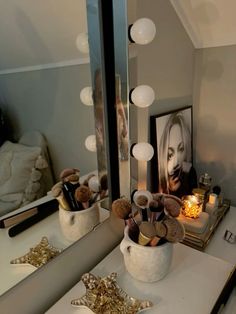 a vanity with a mirror and lights on it