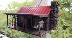 a bird house made out of wood and metal