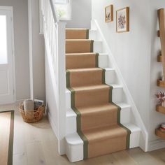 there is a set of stairs with carpet on the bottom, and green trim around the treads