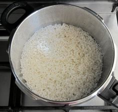 a pot on the stove with rice in it