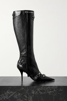 Balenciaga's 'Cagole' knee boots are embellished with the hardware usually seen on the label's bag of the same name. They're crafted from glossy textured-leather in a sleek point-toe shape and poised on slim stiletto heels. Wear yours with a mini dress for high-octane glamour. Luxury Streetwear Boots With Contrast Sole, Luxury Boots With Contrast Sole For Streetwear, Luxury Nylon Boots For Streetwear, Luxury Ankle Lace-up Boots For Streetwear, Balenciaga Corset Boots, Pink Knee High Boots, White Knee High Boots, Summer Shoes Trends, Black Balenciaga