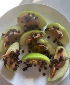 sliced apples and chocolate chips on a white plate