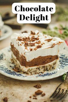 a piece of chocolate delight cake on a blue and white plate