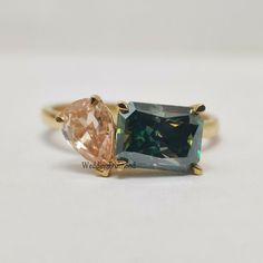 two different colored stone rings sitting on top of each other