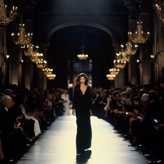 a model walks down the runway at a fashion show