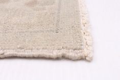 a close up of a rug on a white surface