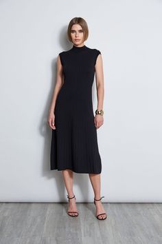 Our Mock Neck Midi Dress is an elevated take on the knit dress trend. Featuring a Fit & Flare silhouette & pointelle rib stitch, this ultra-versatile dress can be easily dressed up with heels or down with sandals. Our Knit Midi Dress is a seasonless must have! Elie Tahari Exclusive Stretch Rib Knit Fit & Flare Midi Dress 67% Rayon, 28% Nylon, 5% Elastane Runs True to Size Model is wearing size 2 Dry Clean Only Imported Style #: E7522604 Mock Neck Midi Dress, Rib Stitch, Mock Neck Dress, Long Sleeve Short Dress, Elie Tahari, Versatile Dresses, Knit Midi, Knit Midi Dress, New Arrival Dress