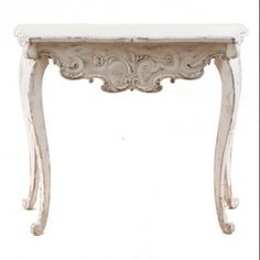 an old white table with ornate carvings on the top and bottom, against a white background