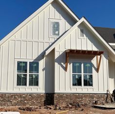 a house being built in the process of being remodeled with new windows and sidings