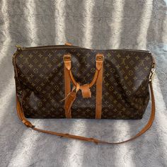 Update 3/24/24: Both Rivets Have Been Replaced And The Bag Has Been Stitched Up By Louis Vuitton!! Comes With Box & Dust Bag. Update 1/11/24: Bag Has Been Shipped To Louis Vuitton To Have Both Rivets (Screws) Replaced!! Will Update Once It Has Been Returned. Beautiful Duffel Bag With Strap, Sad To Let Her Go, Size Is Carry On Approved Screw & Screw Cap On One Of The Handles Is Loose Causing It To Separate (Picture 5) Screw Cap On Strap Holder Is Missing Causing It To Separate; Not A Big Deal To Me But Both Can Be Taken And Fixed :) (Picture 8) Minor Scuffs Due To Normal Wear, Please Review All Pictures Thoroughly! I Also Purchased The Red Insert For The Bag To Avoid Any “Drooping” Louis Vuitton Keepall, Let Her Go, Big Deal, Duffel Bag, Rivets, Travel Bags, Louis Vuitton Bag, Louis Vuitton Monogram, Carry On