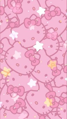 the hello kitty wallpaper is pink and has gold stars, hearts, and flowers on it