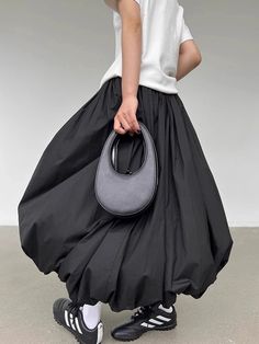 The playful design features a dropped waist and a billowy, gathered shape, adding a unique flair to any ensemble. Its versatile black fabric makes it easy to pair with casual tops and sneakers or dress it up for more polished looks. Ideal for those who love avant-garde fashion with a comfortable twist, this skirt redefines effortless chic. Ruched design Elasticated waistband Low rise A-line Polyester Maxi Skirt Casual, Korean Fashion Summer Street Styles, Empire Pattern, Balloon Skirt, Long Skirt Fashion, Skirt Casual, Corset Bustier, Purchase Order, Bubble Skirt