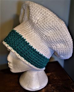 a crocheted hat on top of a mannequin head