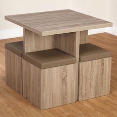 a wooden table with three stools on it