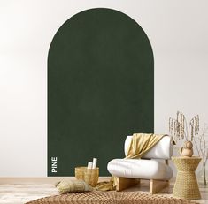 a living room with a green wall and white chair in the corner, next to a wicker table