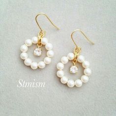 the earrings are made with pearls and gold