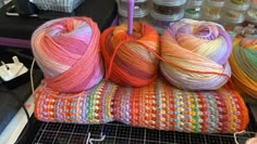 several balls of yarn sitting on top of a table