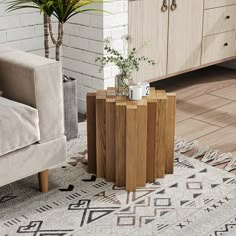 a living room area with a couch, coffee table and potted plant