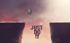 a person jumping off the edge of a cliff into the ocean with words just do it