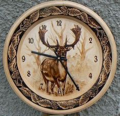 a clock with an image of a deer on it