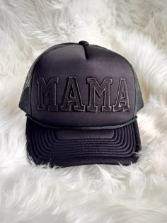 Show off your mama pride in style with this trendy trucker hat! Featuring bold embroidered letter patches spelling out "MAMA," this hat is the perfect mix of comfort and charm. The mesh back keeps you cool, while the adjustable snapback ensures a perfect fit for any head size. Whether you're running errands, spending time outdoors, or just adding a casual flair to your outfit, this "Mama" trucker hat is a fun and fashionable way to celebrate motherhood. Details: High-quality embroidered letter patches Breathable mesh back for comfort Adjustable snapback closure for a customized fit Stylish and durable design, perfect for everyday wear Ideal gift for moms, new moms, or mama-to-be Complete your casual look with this must-have accessory! Black Snapback Hat With Letter Print And Curved Bill, Black Letter Print Snapback Trucker Hat, Trendy Black Trucker Hat With Embroidered Logo, Black Snapback Trucker Hat With Letter Print, Adjustable Black Trucker Hat With Letter Print, Personalized Black Curved Bill Snapback Hat, Adjustable Black Snapback Hat With Letter Print, Black Adjustable Snapback Hat With Letter Print, Trendy Black Trucker Hat With Letter Print