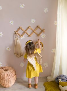 Keep the warmth of summer in your little one's room with our new Simple Daisy Flower Wall Decals. These simple daisies are a great way to brighten up any kid's room or nursery. Their simplistic design and easy application make it the perfect project for any child and parent to enjoy!Size:Daisy Size: (approx): 4.5"w x 4 Daisy Decals Bedroom, Flower Mural Kids Room, Flower Wall Kids Room, Daisy Wall Nursery, Daisy Theme Bedroom, Toddler Flower Room, Boho Daisy Bedroom, Light Pink Toddler Room, Daisy Kids Room