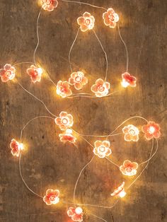 a bunch of lights that have flowers on them