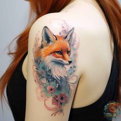 a woman with a tattoo on her arm has a red fox and flowers in it