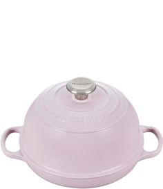 a pink casserole dish on a white background